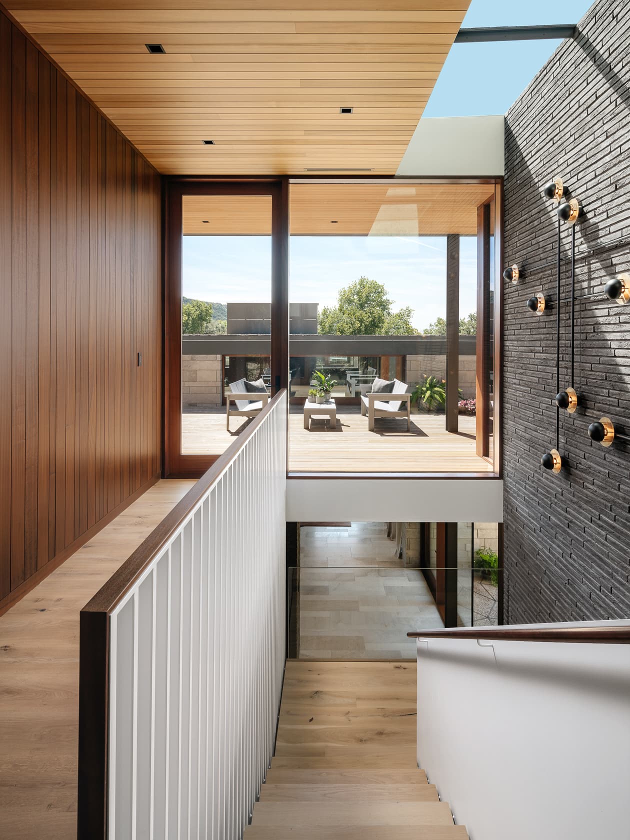 Water's Edge Residence - top of staircase view towards outdoor patio; A Parallel Architecture